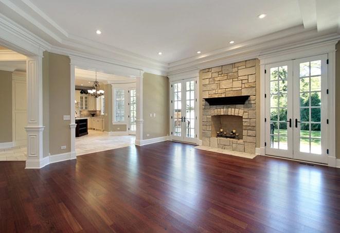 sunlit bedroom with elegant hardwood flooring